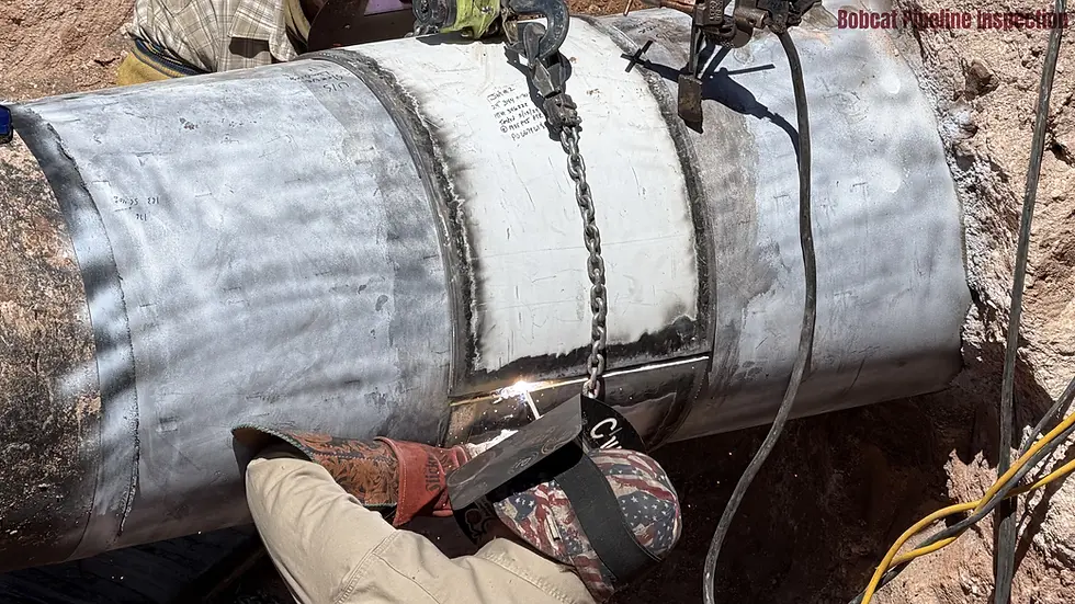 Welder completing a sleeve repair on a natural gas pipeline.