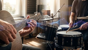 Close-up of hands playing an acoustic guitar and a snare drum in a music studio with glowing neural network overlays