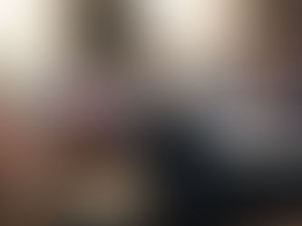 Close-up of hands playing an acoustic guitar and a snare drum in a music studio with glowing neural network overlays