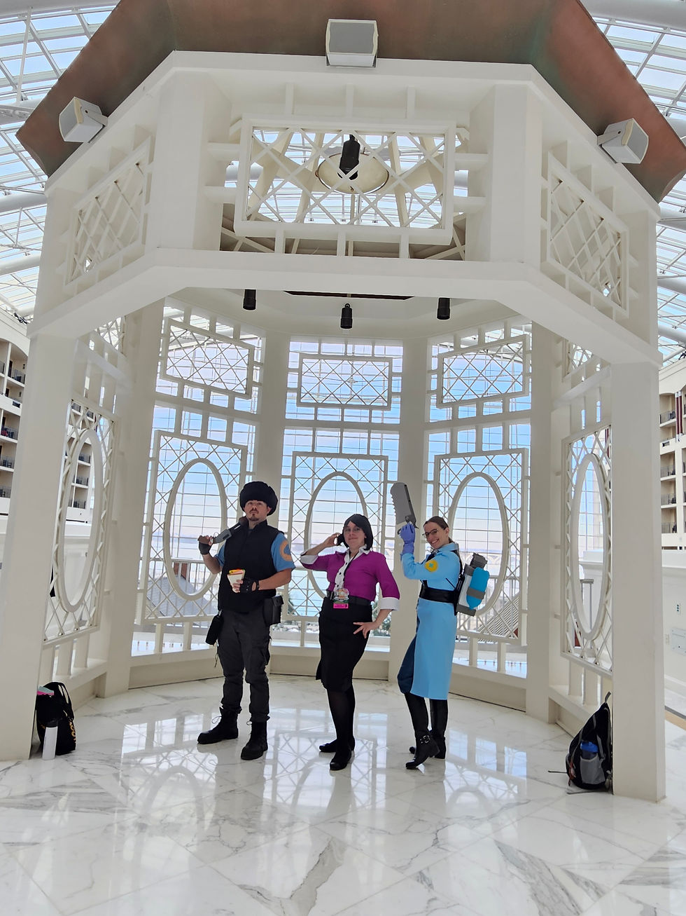Heavy, Ms. Pauling, and Medic cosplay in the famous Gaylord gazebo at MAGFest