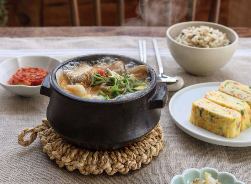 Doenjang jjigae with spring naengi greens. © wtable