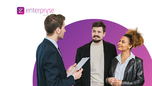 Three professionals in business casual attire having a conversation in front of a purple circular background, with the Enterpryze logo and 'Effortless ERP' tagline visible in the top left corner.