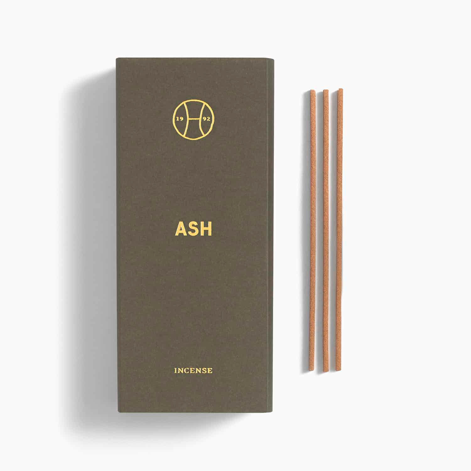 Japanese incense beside its box packaging.