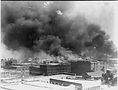 Smoke_billowing_over_Tulsa_Oklahoma_during_1921_race_riots_LCCN95517018.jpg