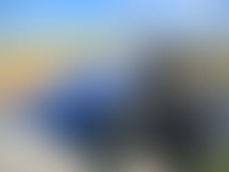 A breath-taking view from Hadrian's Wall, high up on a craggy outcrop over looking a deep lake below.