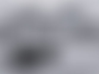 An old medieval canon, in front of a creepy looking haunted castle. Chillingham Castle the most haunted castle in England