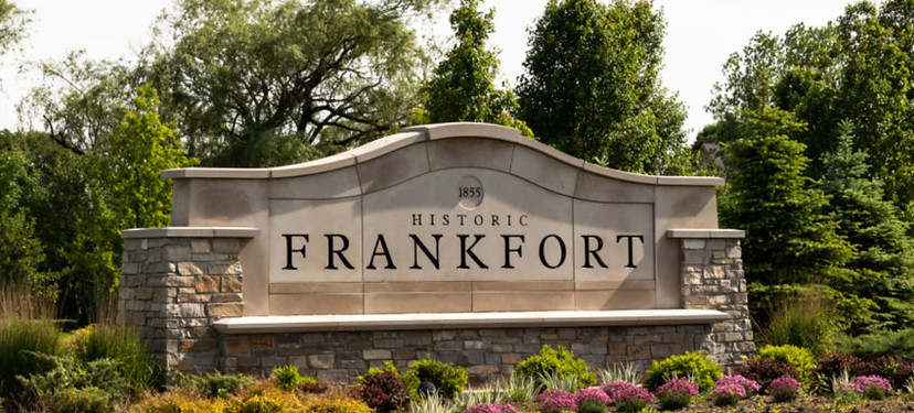 Historic Frankfort welcome sign in Frankfort, IL surrounded by landscaping and greenery representing the local community served by Legacy Glass Block & Window Co.