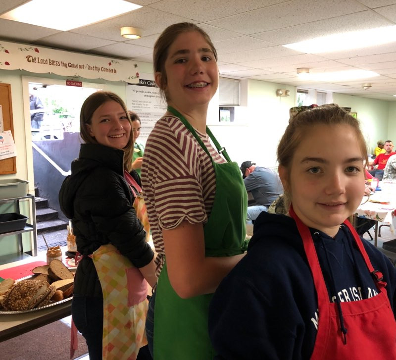 Our youth are on three rotating teams: serving, dining & kitchen duty. Servers hand out food, diners sit with St. Luke's guests and share a meal with them, and kitchen duty help with food preparation. Here is a photo from toady's serving team!