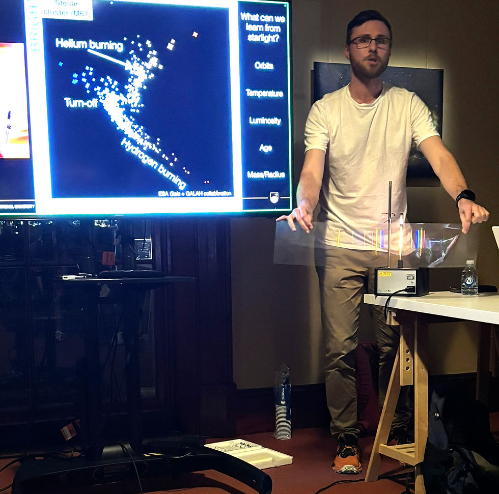 Sven demonstrating how spectroscopy works using a spectrum lamp, spectrum tube and a plastic grating (Photo credit: Toner Stevenson).