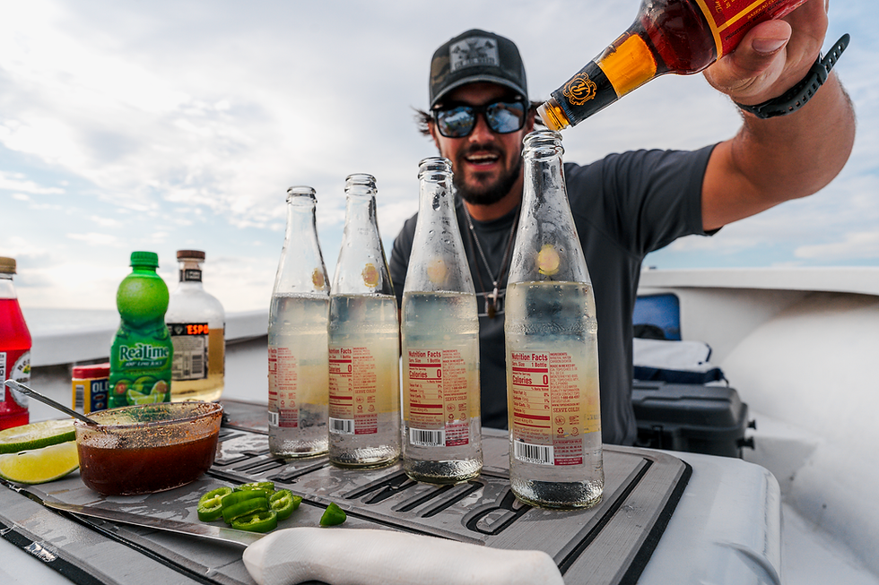a man on a boat making a cocktail