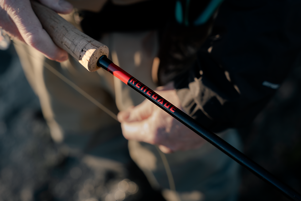 Angler holding the Renegade Black Series 8WT fly rod.