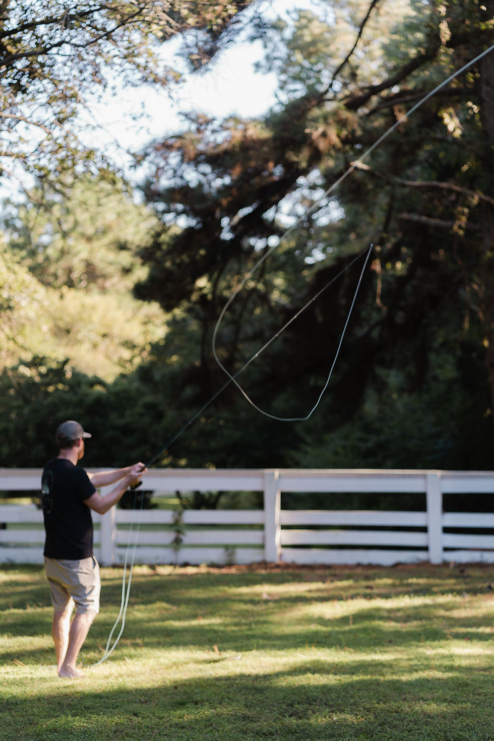 Fly fishing cast instructor giving lessons.