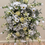 Thumbnail: Traditional funeral flowers with white roses, lilies & soft greenery