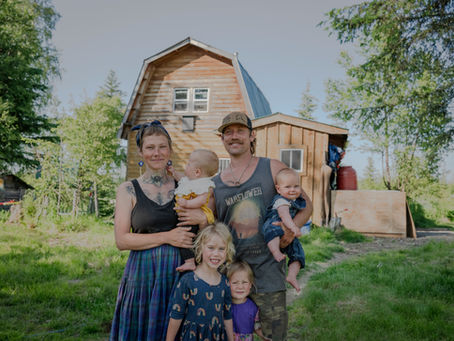 family of 6 in an off-grid tiny home on wooded acreage in Alaska