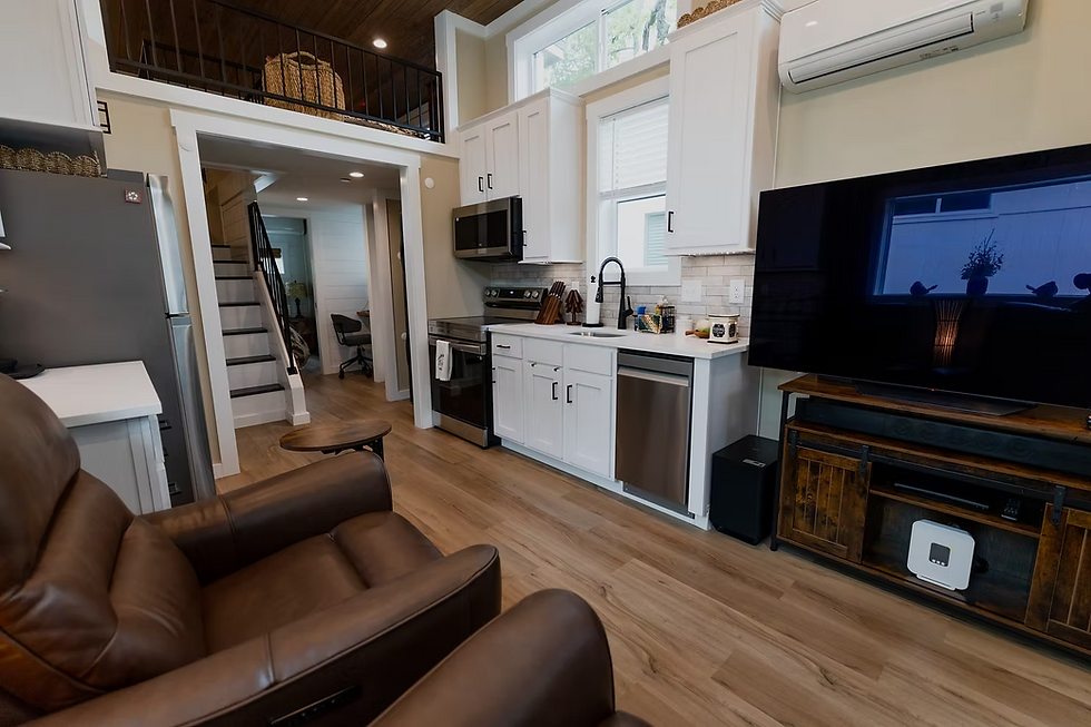 Tiny home living room with full-size TV and recliner chairs in Texas