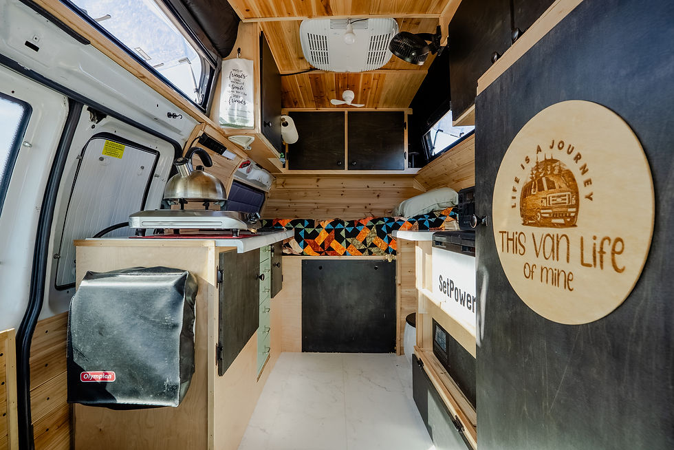 Van bunk bed with a cedar wall panel built over the rear doors