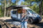 Beth standing outside her camper van