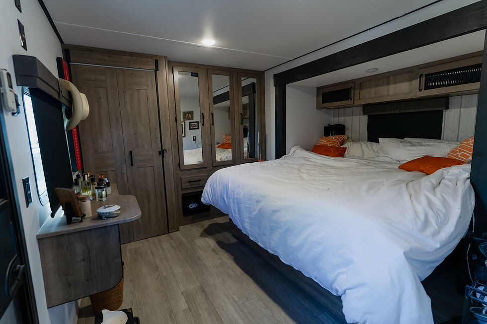 a downstairs king-size bedroom in a destination trailer