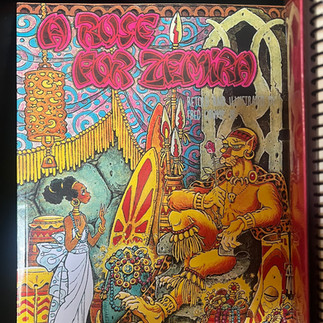 Cover of A Rose for Zemira by Fred Crump Jr., featuring richly illustrated Black fairy tale imagery with a young Black girl, a regal panther figure, ornate jewelry, architecture, and symbolic objects. The book remains part of Kiing Curry’s personal library and served as an early inspiration for the Black Fairytales series.