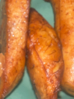 Soft, unfocused image of fried plantains, edges blurred, sweetness present but just out of reach, li