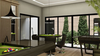 Sala de jogos residencial com mesas de sinuca e pebolim, sofá e painel com TV, integrada visualmente ao jardim de inverno por amplas aberturas envidraçadas. O ambiente apresenta piso e painéis amadeirados, iluminação direta sobre as mesas e vegetação interna, criando uma atmosfera acolhedora, elegante e conectada à natureza.
