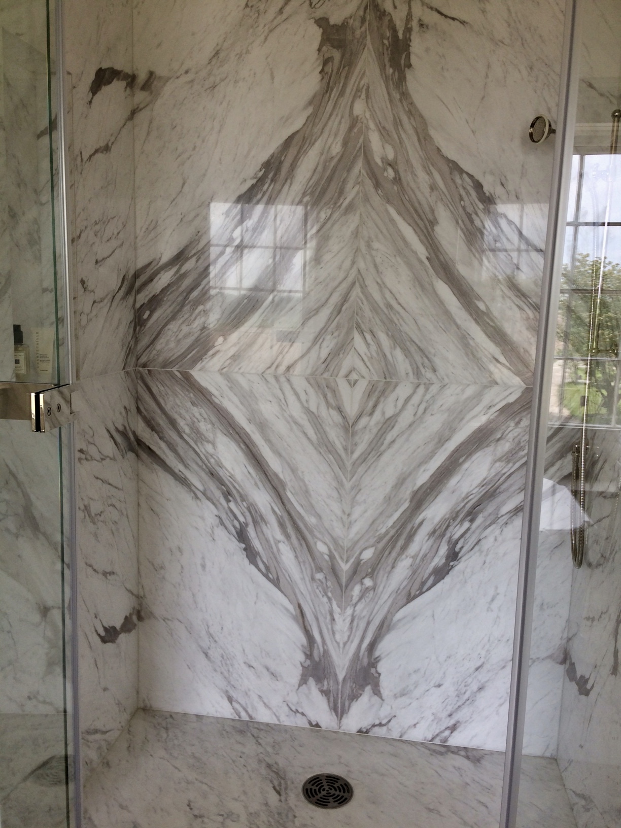 Wall cladding and shower trays