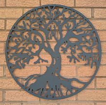 Image shows a tree of life metal sculpture at Wanderwood Coaching in Winchcombe near Cheltenham where coaching is offered in person or online for adults.