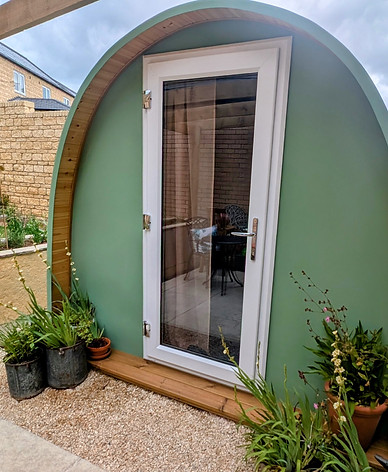 Image is an external photo of the garden pod in Winchcombe near Cheltenham where Wanderwood Coaching offers in person or online coaching sessions for adults across a range of topics including neurodivergence, ADHD, autism, diagnosis, reasonable adjustments at work, lifestyle, life transitions, families including blended families, single parenting and co-parenting, corporate careers, career changes and work life balance.