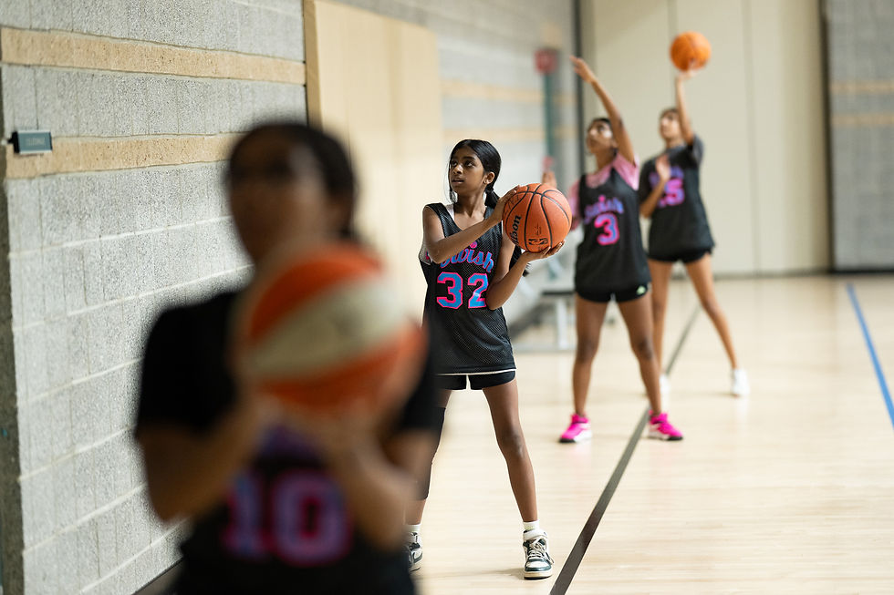 Eye-level view of a youth basketball player practicing a controlled dribble.