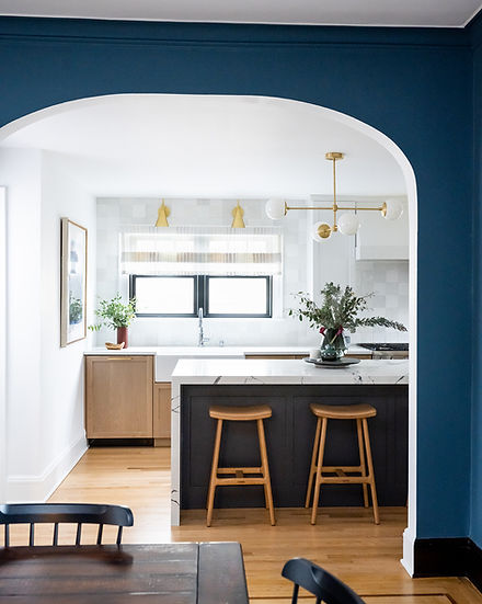 Kitchen and dining room connected with an arch.