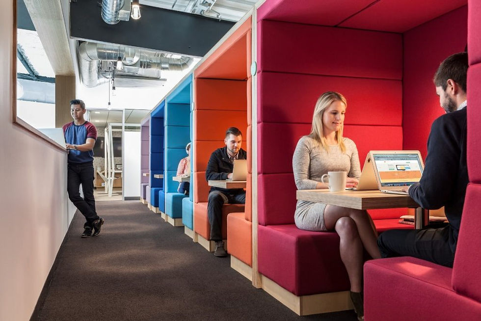 People in colourful booths