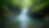 Eye-level view of a cascading waterfall surrounded by lush greenery