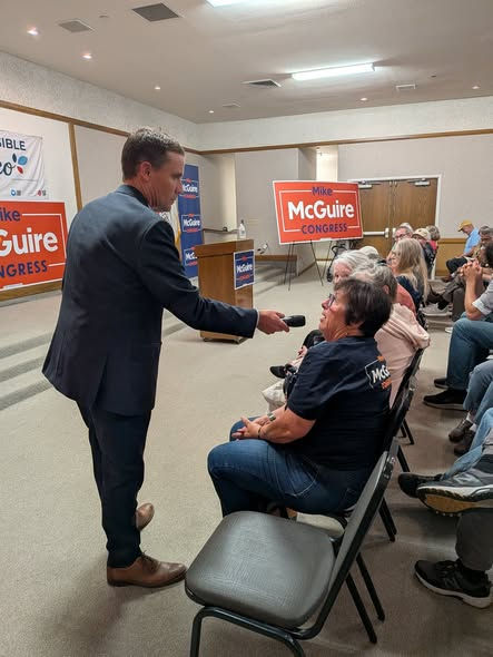 Mike takes a question from Celeste Garcia at his Town Hall.