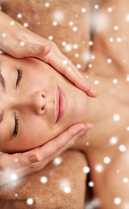 people, beauty, spa, winter and relaxation concept - close up of beautiful young woman lyi