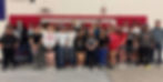 Treasurer Laura M. Montoya and Deputy T Janice Y. Barela pose for a group picture with high school students in Estancia, New Mexico.