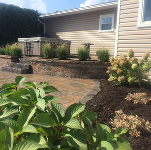 Curved Retaining Wall with Paver Patio and Stone Staircase
