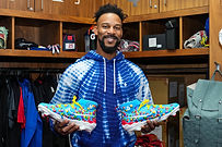 Byron Buxton showing off his custom Skittles cleats made by Tara Aiken