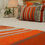 Thumbnail: 24" x 16" African Boho Orange Orchard Pillow with Flint Fringing