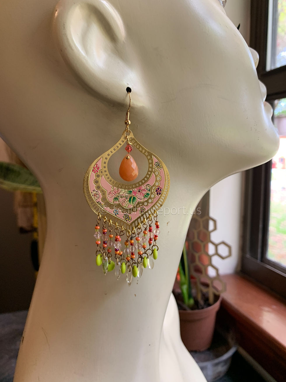 Thumbnail: a different view of the mannequin wearing the handmade earrings
