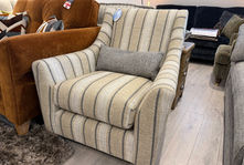 Striped armchair with lumbar pillow in a furniture store