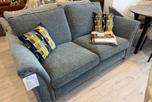 Grey fabric two-seater sofa with patterned cushions