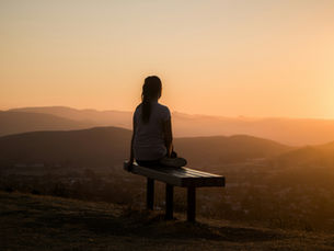 Woman reflecting after therapy session on listening, healing, and becoming ones true self.