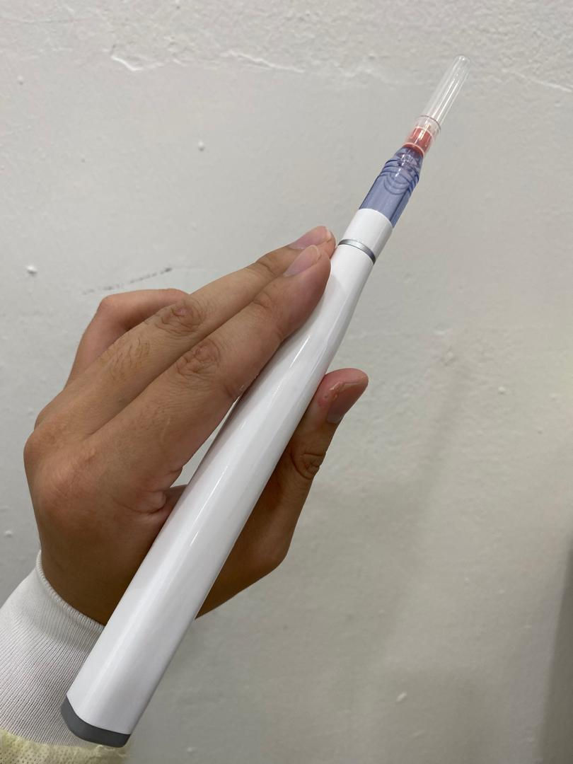 an electronic low-pain injector - pictures taken in Paddington Dental SP 