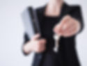 Real estate agent offering house keys