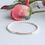 Thumbnail: White and silver noodle tube bracelets