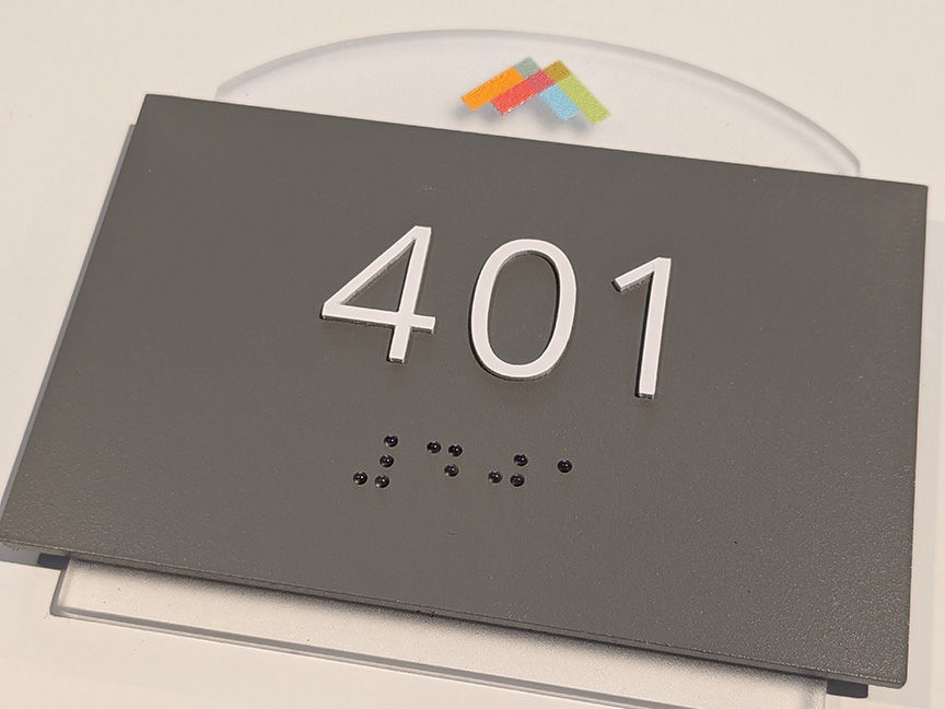 gray and clear acrylic branded logo grade 2 braille ADA unit address sign
