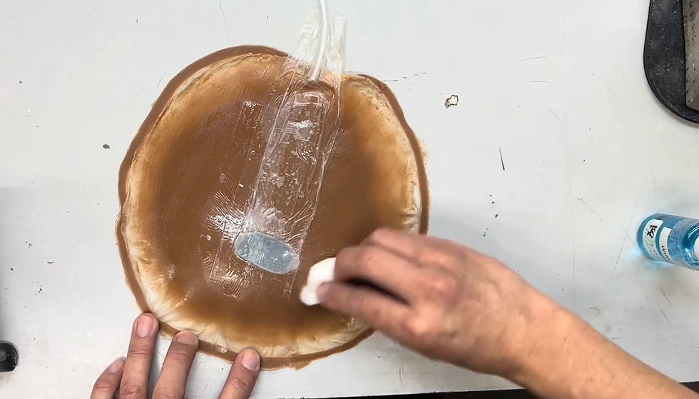 Cleaning a prosthetic with Windex.