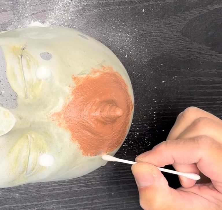 Clean the outside of the sculpture's edges.