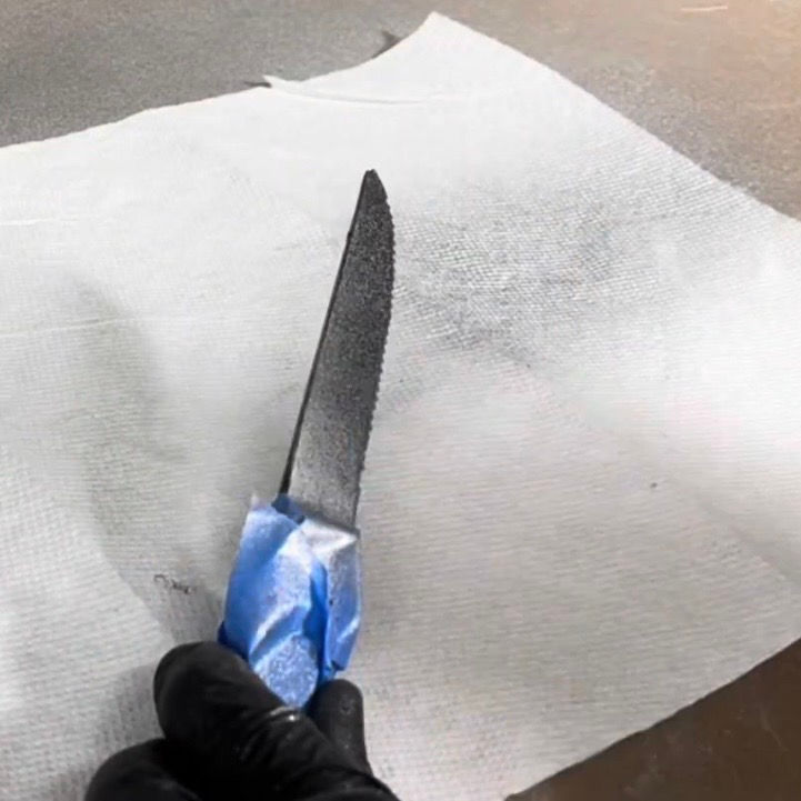 Spraying metallic paint.