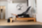 man wearing black doing reverse plank on the box